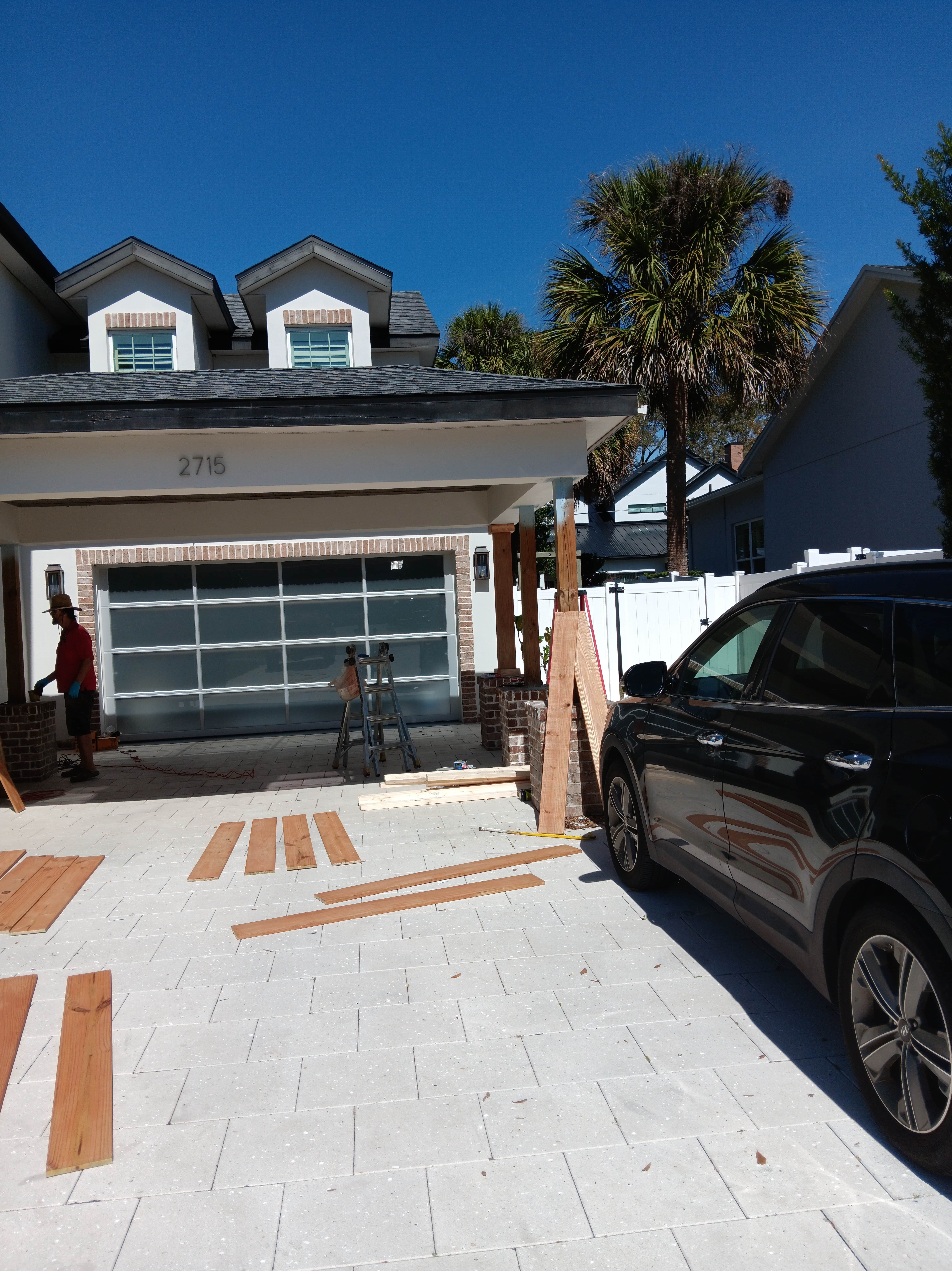 A car is parked in front of a house