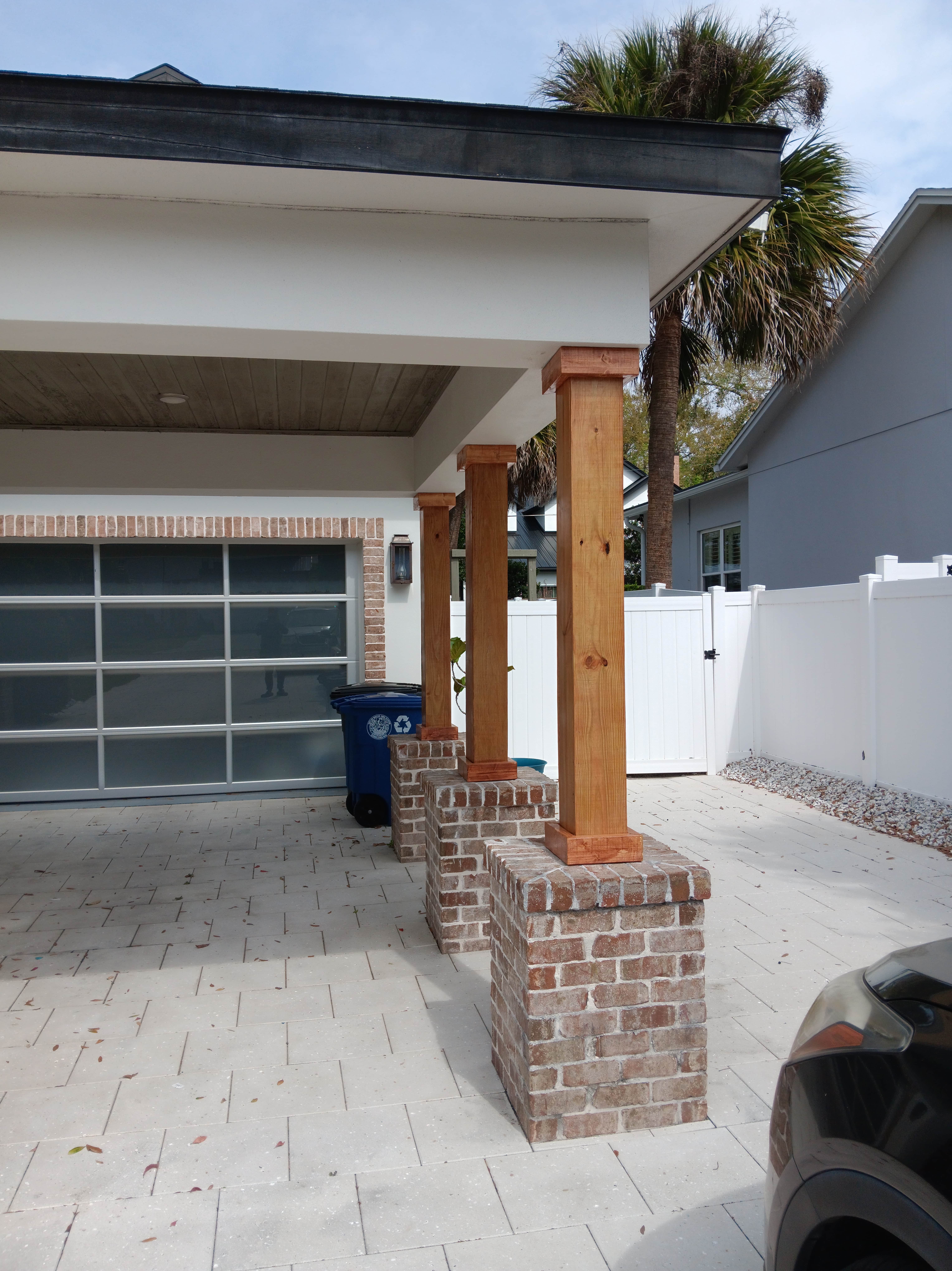 A house with a car parked in front of it